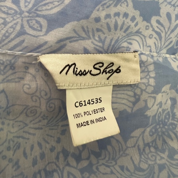 Light weight blue and white scarf. Polyester. With Pom poms at either end - Picture 9 of 9